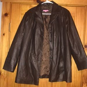 Vintage women within brown leather button up jacket